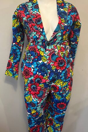 Woman’s multicolor Ankara floral blazer and trouser suit with bold blue, red, and yellow African print design