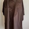 A premium modern traditional African men wear Agbada set in charcoal grey featuring embellished detailing.