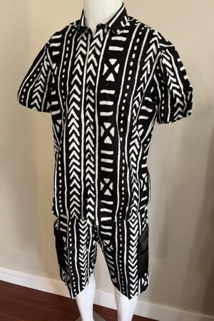 A mannequin displaying a premium 100% cotton men's african print set featuring cargo shorts and a short-sleeve button-down shirt.